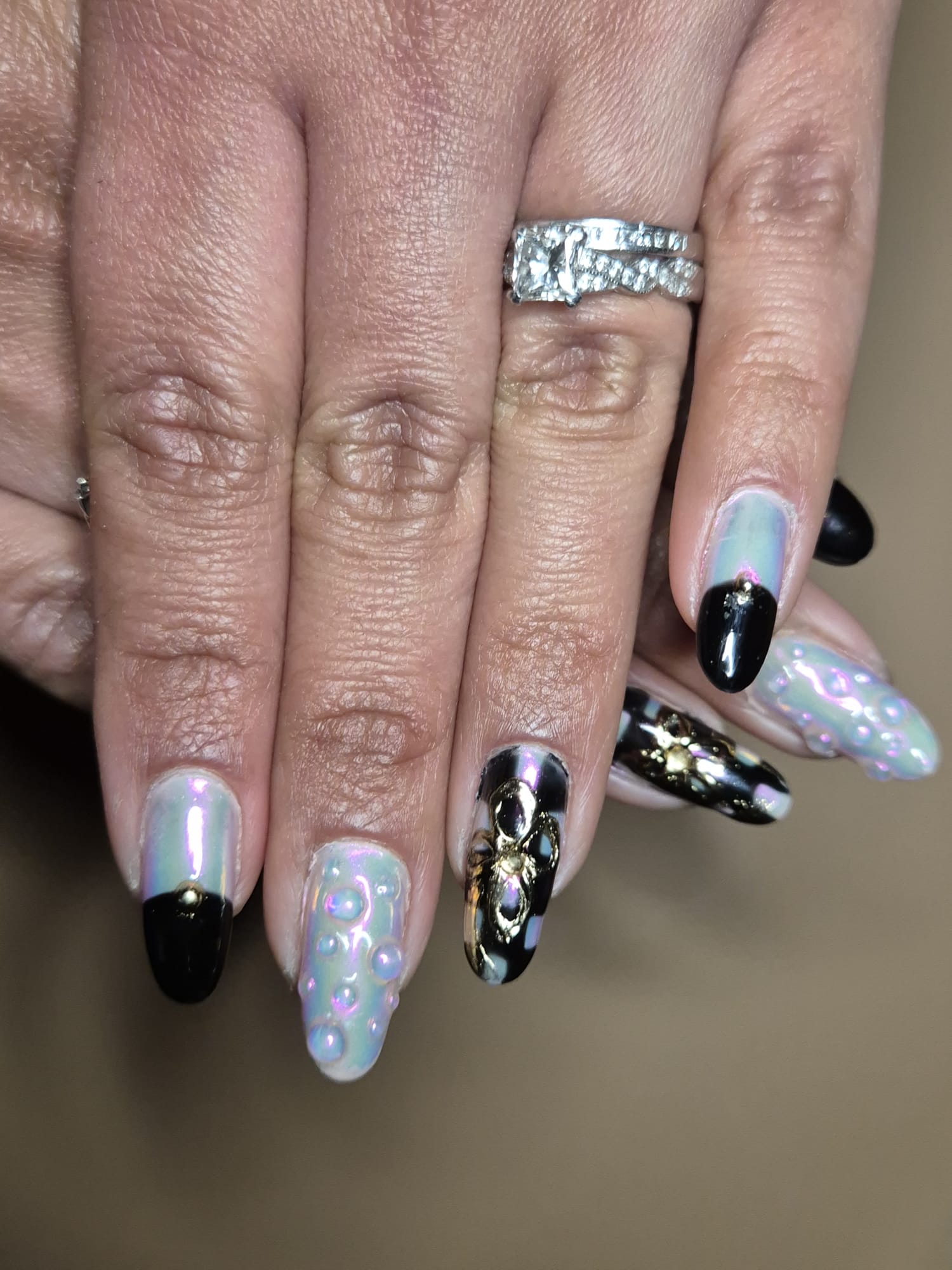 Aurora chrome nails with 3D bubbles and gold spider charms