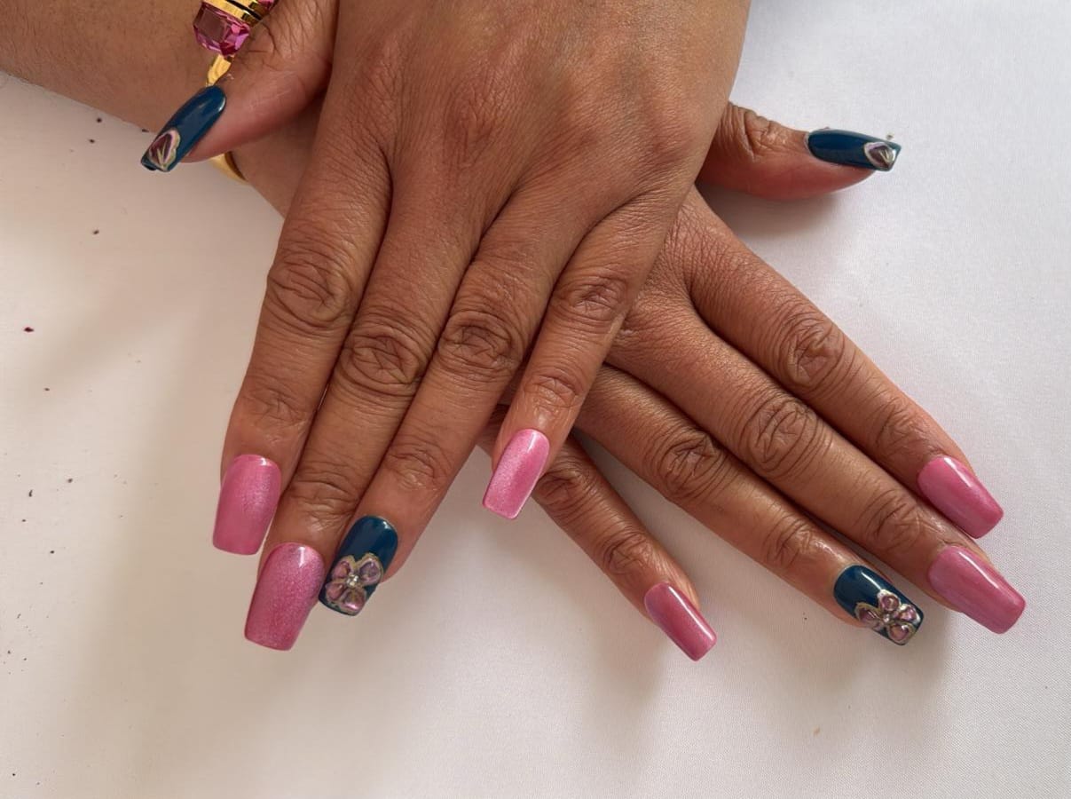 Long coffin nails, pink cat-eye with teal and 3D flower gems